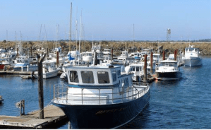 a boat is docked next to a body of water