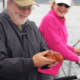 a person holding a fish