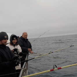 a group of people on a boat in the water