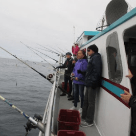 a group of people standing around a bus