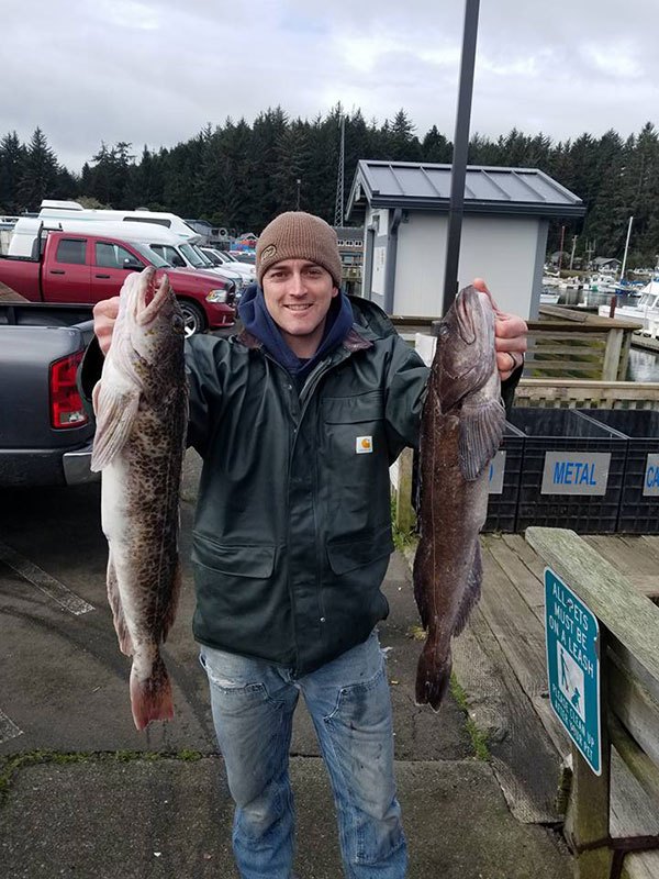 a man holding a fish