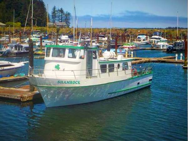 a boat is docked next to a body of water